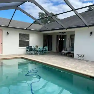 Cheerful 4 Bed, 3 Bath Home with Screened Pool Fitness & Recreational Facilities