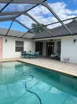 Cheerful 4 Bed, 3 Bath Home with Screened Pool