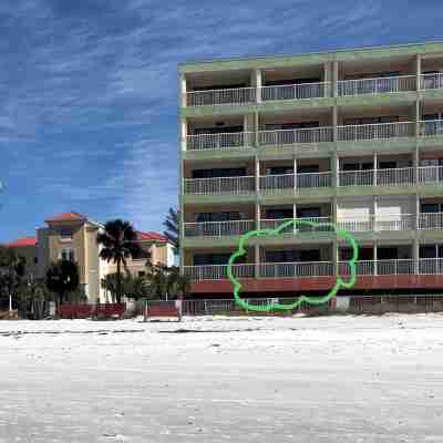 Enjoy beautiful sunsets from the balcony or wade into the waves just steps away! Hotel Exterior