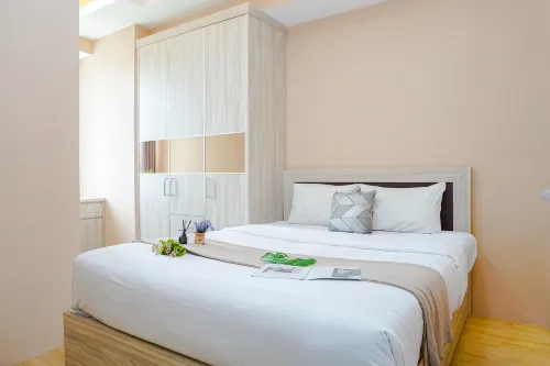 Comfy and Homely Space 2BR at Apartment Vasanta Innopark By Travelio - Homestays