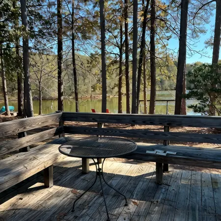3-bedroom cabin nestled on 80 acres with WiFi, AC on private 5-acre lake.