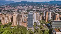 York Medellin, Curio Collection by Hilton - Pool