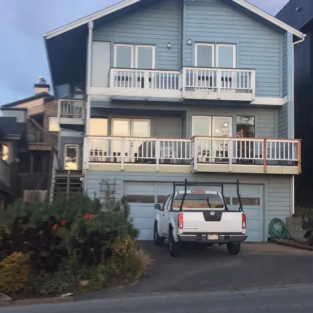 Beachfront home directly across from beach & park! Close to everything!