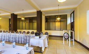a large conference room with multiple tables and chairs , all set up for a meeting at Rainbow Ruiru Resort