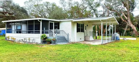 House with 3-bedroom 2 Bath on one acre of land in wonderful Wesley Chapel