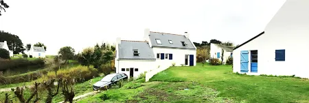 House on the wild coast of beautiful island at sea