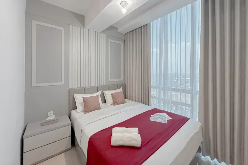 Combined Grey Toned 2BR Apartment at The City Square Surabaya By Travelio