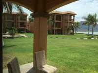 PARADISE AT BAHIA DELFIN / BEAUTIFUL  1ST FLOOR, POOLSIDE, OCEANVIEW , GOLD ZONE - โฮมสเตย์