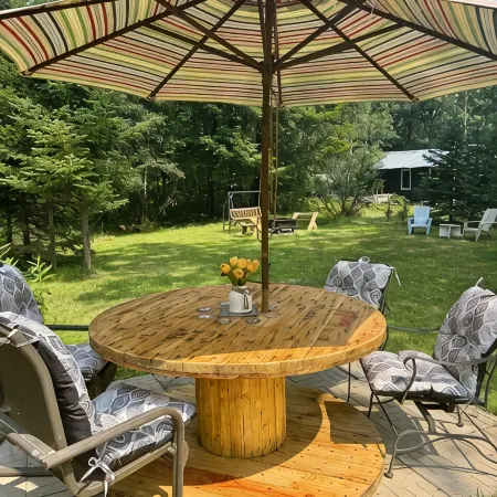 Cozy 2 bedroom cabin with fireplace steps to sand bottom swimming and lake views