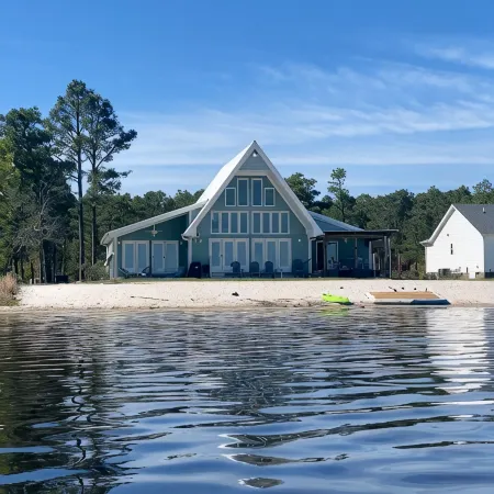 Lake front living with private sandy beach!