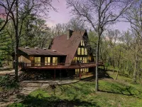 Spacious A-Frame sleeps 25 on 5 wooded acres with a private fishing pond