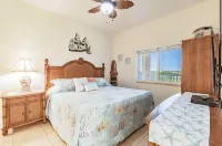Top-Floor Waterfront Condo with Bay View + Pool and Hot Tub