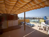 Golden Beach n. 12, Top Floor Apartment with Private Roof Terrace by El Sirocco