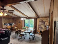Quiet cabin in the woods w/ access to pools, river, & lakes in gated community!!