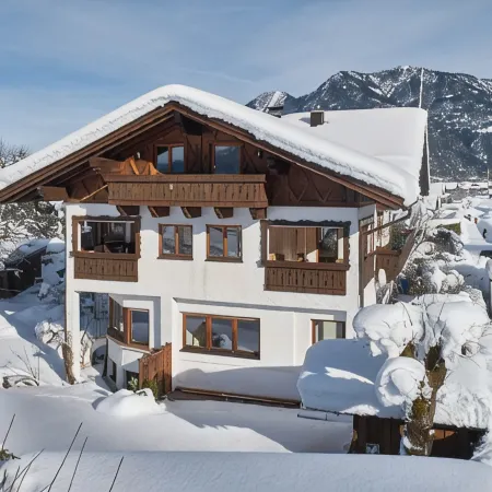 Cozy 65 sqm attic apartment with open roof truss and two balconies