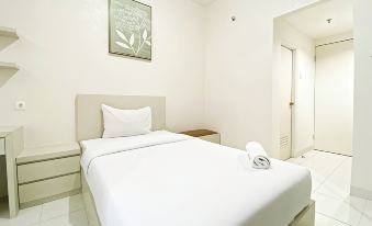 Minimalist and Homey Studio Room at Amartha View Apartment