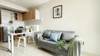 Scandinavian Minimalist 2BR at Cinere Bellevue Suites Apartment By Travelio