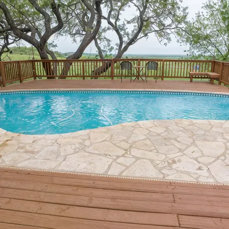 Come enjoy our peaceful house oasis that features a backyard patio with a pool!