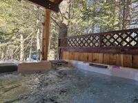 New to VRBO- Wooded cabin, close to Yellowstone with a hot tub