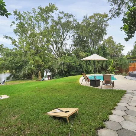 Mid-Century Boho Chic home with Pool, Game Room & Outdoor Playhouse.