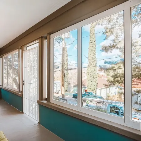 Refined Miner’s Cottage: Fenced Yard, Screened Porch.