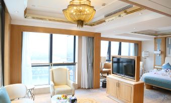 living room with large windows and a television in the center, accompanied by an elegant design at KinDream Hotel