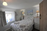Sunbeam Cottage nestling in the heart of Branscombe village with a parking space