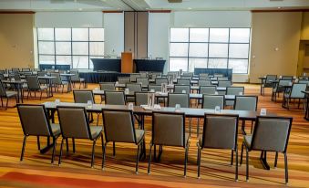 a large conference room with rows of chairs arranged in a semicircle around a long table at Rocky Gap Casino & Resort