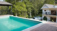 Pakoid Cottages Отели в г. Вандиперияр