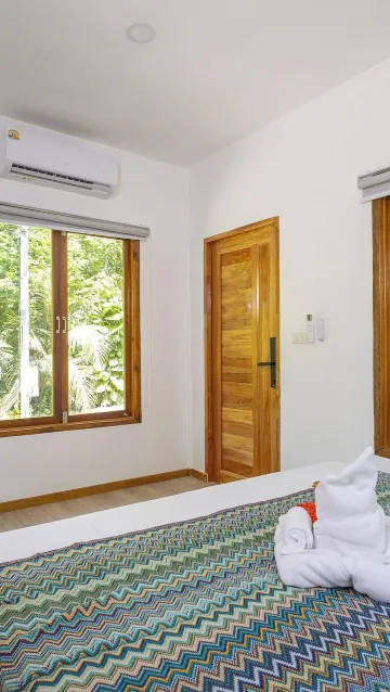 ห้องคอมฟอร์ทสตูดิโอพร้อมระเบียงและวิวสวน