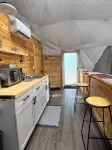 Cozy lakeside glamping dome with fireplace, AC and full bath.