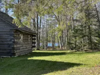 New!  Sleeps 15 Level lawn to lake.  Sandy beach.  Two docks. Great fishing.