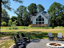 Secluded waterfront getaway with hot tub,fire pit, and private dock.