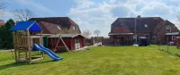 Gemütliches Ferienhaus mit Whirlpool, Sauna und Garten mit Deichblick - Homestays