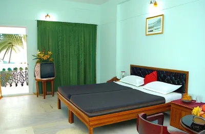 Hotel Green Palace Hotels near GORUBATHAN Tour and Travels