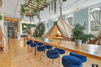 Experience Stay at the Glamping Loft Lake Geneva |Group Stays |12 Stylish Tent Suites |Kitchen & Bar Hotels in Lake Geneva