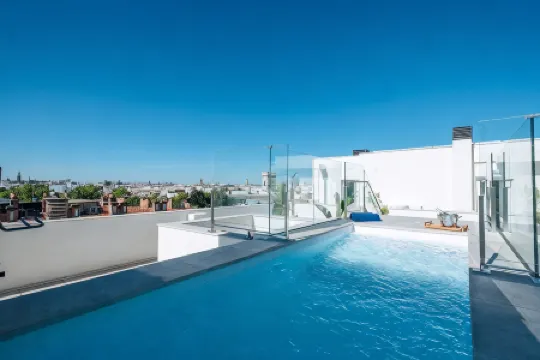 Sercotel Sevilla Guadalquivir Suites Отели рядом с достопримечательностью «Мост Баркета»