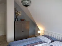 Fantastic vacation apartment near the beach with fireplace, quiet location Hotels in Dranske