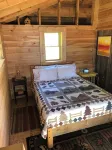 Cozy, Off-Grid Camp on Spectacle Pond w/ private water frontage!