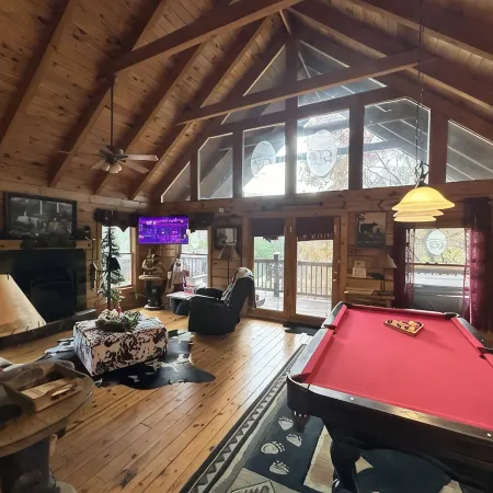 Honeymoon Log Cabin with Heart Shaped Whirlpool Tub & Hot Tub on Covered Porch