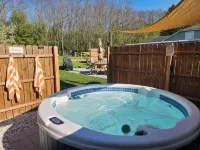 Private Hot Tub, Outdoor TV, near Downtown & Lake Michigan Beaches! - 4-Star