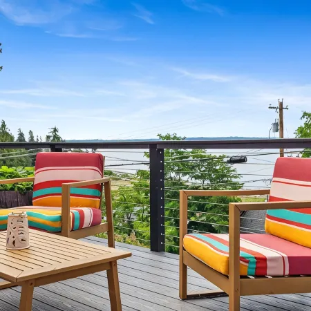 Darling pink beach house with epic views in a cozy community.