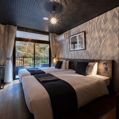 Onsen Guesthouse Tsutaya Hotels near محطة كوواكوداني