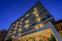 Manousos City Hotel Отели рядом с достопримечательностью «Anthony Quinn Bay»