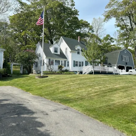 Enjoy spectacular views of Lobster Cove. Large yard, EV charger & dog friendly.