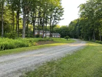 Spacious five-bedroom home off Back Lake with direct trail access on Spooner Rd
