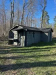 Charming cabin in delightful Duquette with AC near miles of ATV trails.