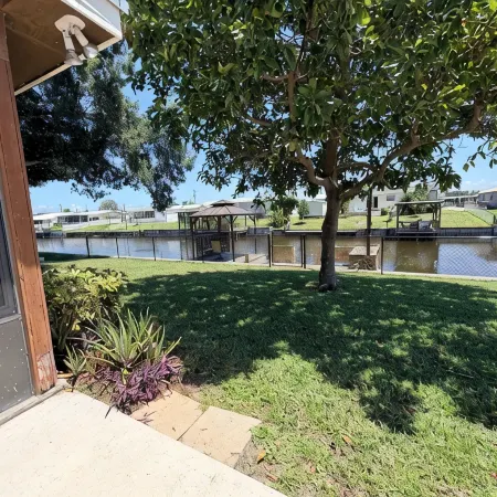 Cozy Water Front 2 Bedroom 2 Bathroom Home with Lake Access and Fenced Backyard.