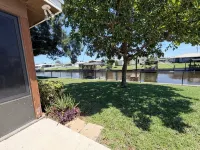 Cozy Water Front 2 Bedroom 2 Bathroom Home with Lake Access and Fenced Backyard.