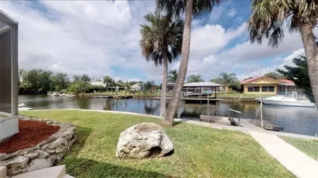 Spacious 3 BR 2 Bath  House On Deep Canal With Screened Heated Pool